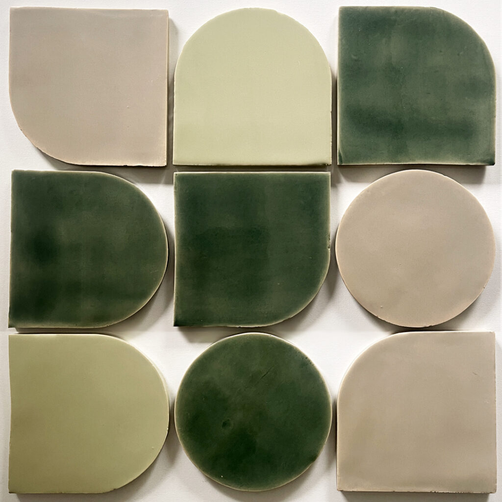 Nine Smink Studio shaped glazed ceramic tiles in green, sage and taupe, showing arch, circle and rounded-corner formats.