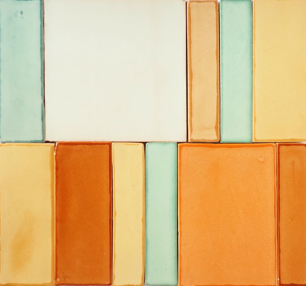 Smink Studio handmade tiles in a range of formats and sizes, from tall narrow rectangles to squares, glazed in cream, mint green, mustard and orange.