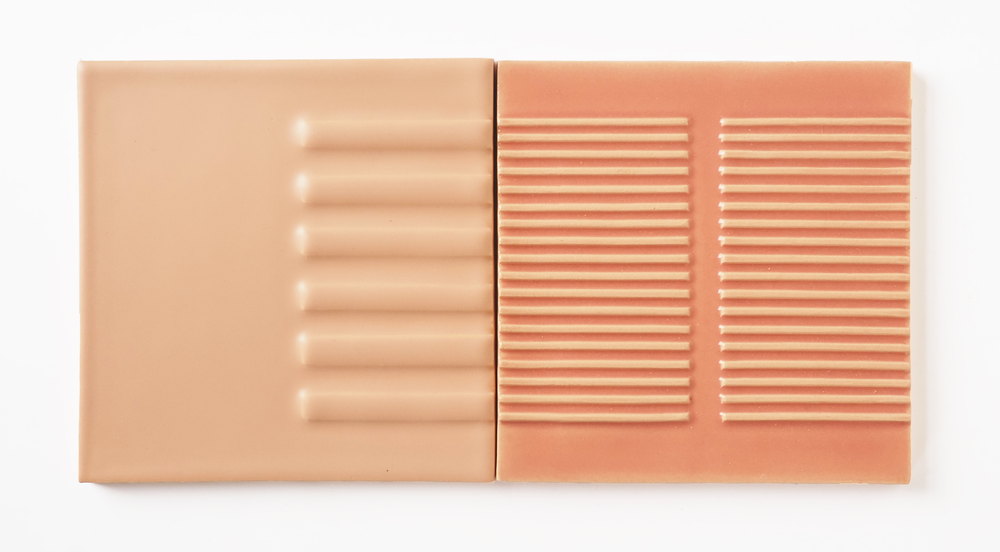 Two blush pink Smink Studio Relief tiles side by side, one with wide vertical flutes and one with fine horizontal ribs.