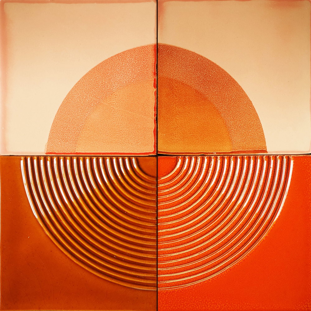 Four Smink Studio tiles forming a single composition, with a speckled orange half-circle screen-printed across the upper tiles and a raised concentric arc Relief pattern below.