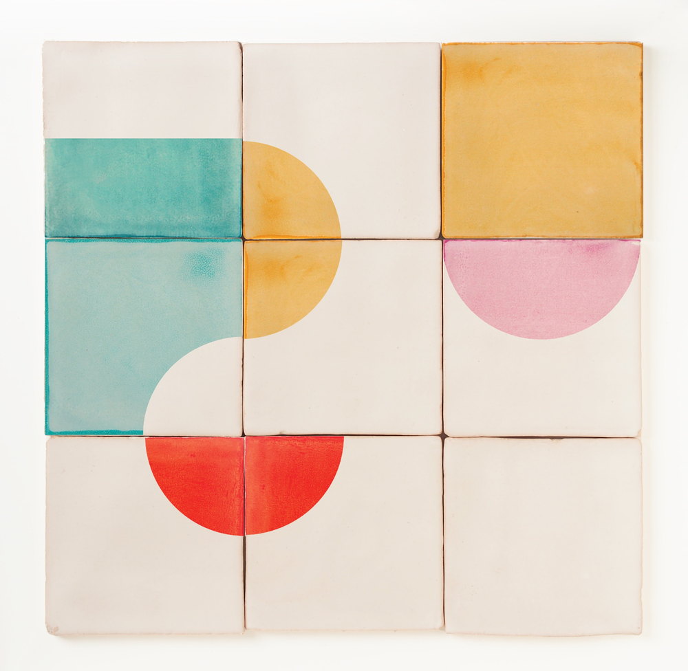Nine Smink Studio handmade tiles in a three by three grid, screen-printed with teal, mustard, pink and red half-circles and blocks on cream.