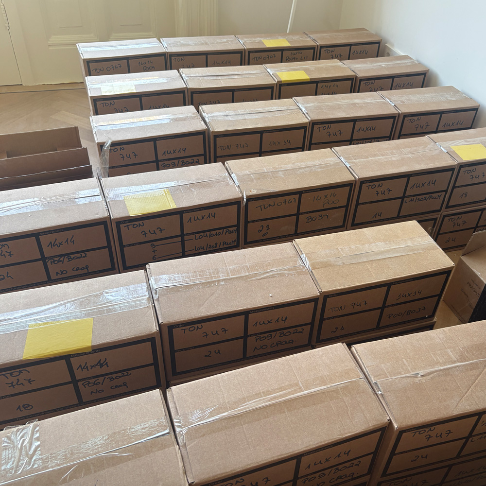 Boxes of handmade tiles arranged on the floor